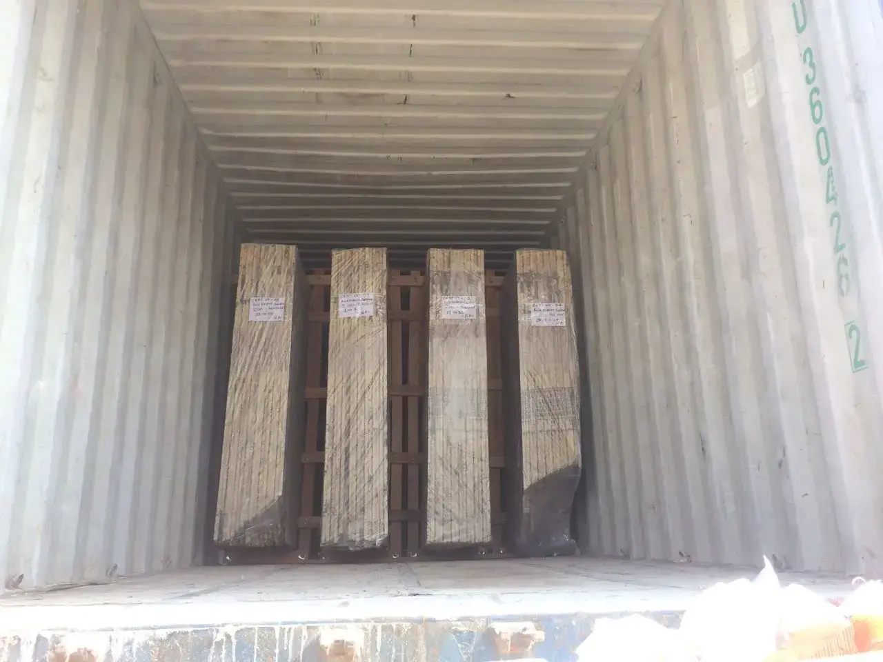 Stone container being loaded for export from India — FOB CIF Incoterms guide